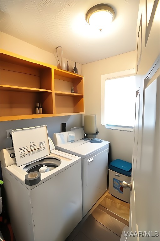 laundry room with laundry area and washer and clothes dryer