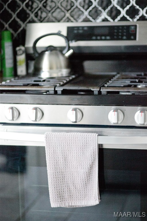 room details featuring stainless steel gas range oven