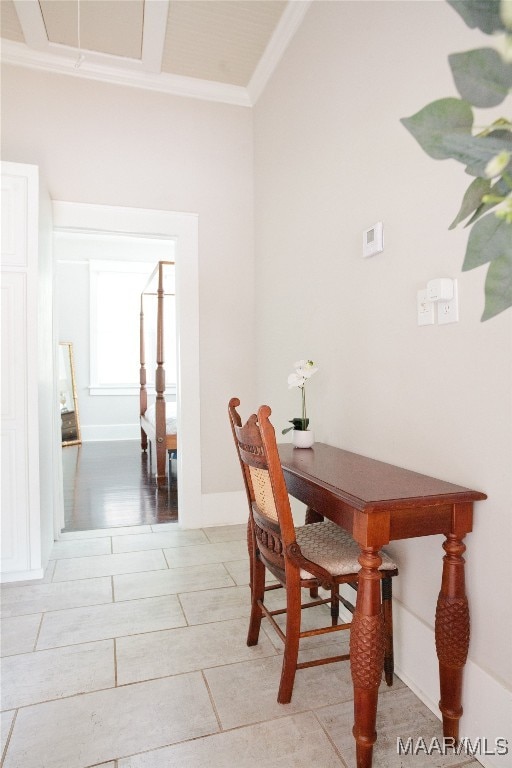 dining area with baseboards and ornamental molding