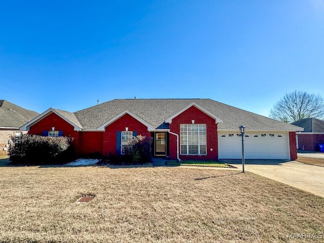 ranch-style home featuring concrete driveway, an attached garage, and a front lawn