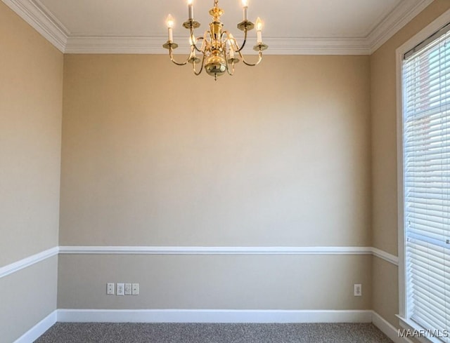 empty room featuring baseboards, a notable chandelier, carpet floors, and ornamental molding