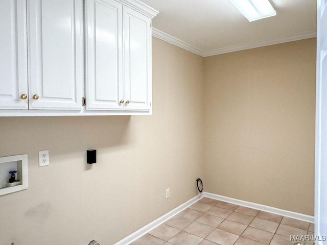 washroom featuring light tile patterned floors, baseboards, cabinet space, washer hookup, and crown molding