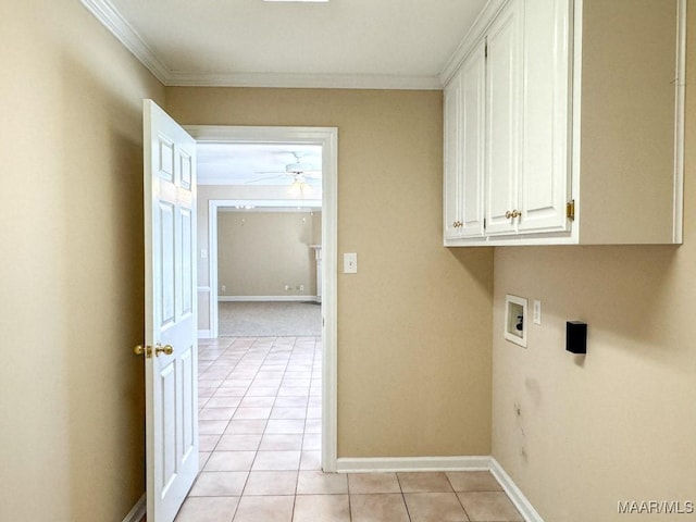 laundry area featuring washer hookup, ornamental molding, a ceiling fan, cabinet space, and light tile patterned floors