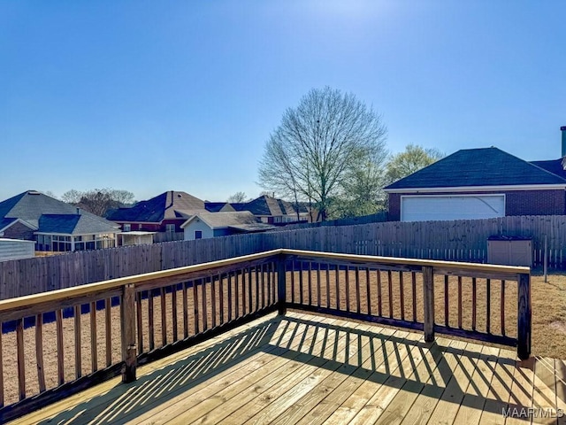 wooden deck featuring a fenced backyard