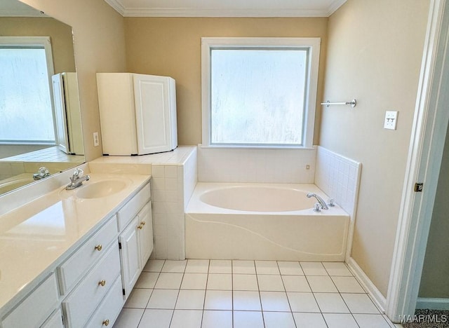 bathroom with tile patterned floors, vanity, crown molding, and a garden tub