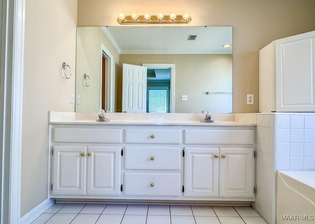 bathroom featuring tile patterned floors, double vanity, visible vents, and a sink