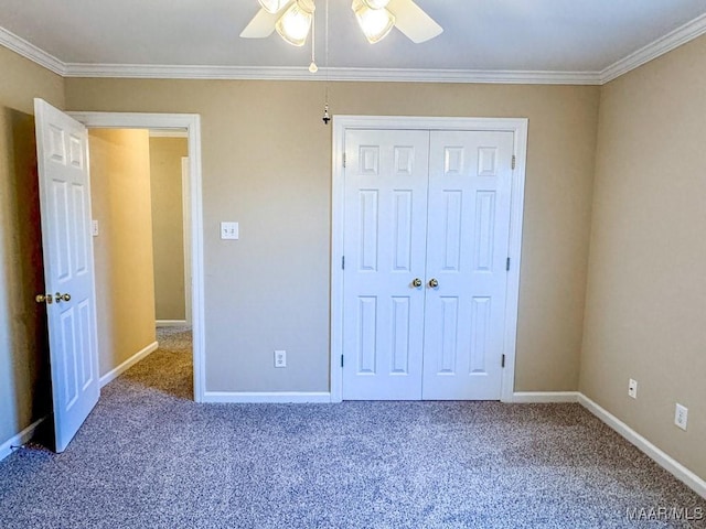 unfurnished bedroom with a closet, carpet, and ornamental molding