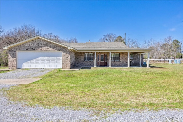 ranch-style home with brick siding, a garage, gravel driveway, and a front yard