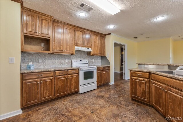 kitchen with white electric range oven, visible vents, a sink, under cabinet range hood, and backsplash