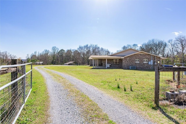 view of road with driveway and a gated entry