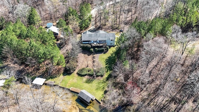 birds eye view of property with a wooded view