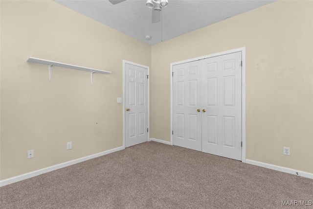125 Greenfield Pl, Wetumpka, AL 36093 - unfurnished bedroom featuring a textured ceiling, a closet, carpet floors, baseboards, and ceiling fan