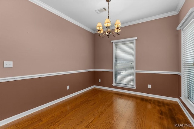 125 Greenfield Pl, Wetumpka, AL 36093 - empty room featuring visible vents, crown molding, baseboards, an inviting chandelier, and wood finished floors