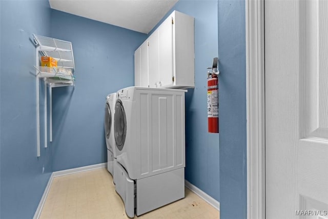 125 Greenfield Pl, Wetumpka, AL 36093 - laundry area with baseboards, light floors, cabinet space, and washing machine and clothes dryer