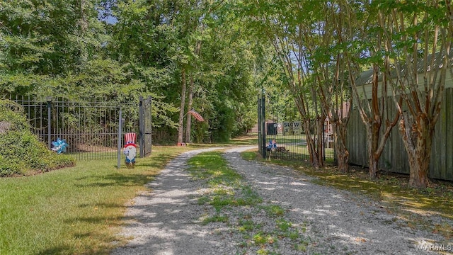 view of community featuring fence