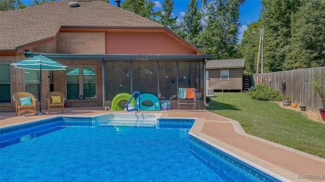 125 Greenfield Pl, Wetumpka, AL 36093 - view of swimming pool with a patio, a fenced in pool, fence, a sunroom, and a lawn