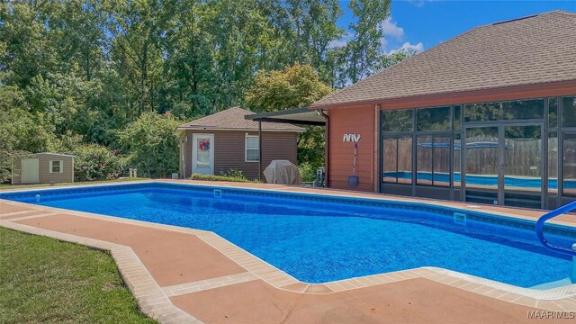 125 Greenfield Pl, Wetumpka, AL 36093 - outdoor pool with a storage shed and an outdoor structure