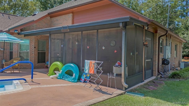 125 Greenfield Pl, Wetumpka, AL 36093 - view of outbuilding with an outdoor pool, central AC, and a sunroom