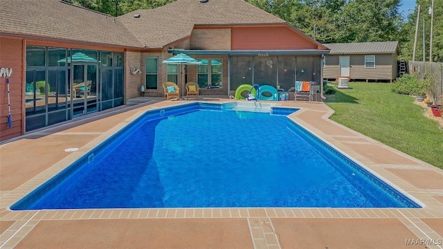 125 Greenfield Pl, Wetumpka, AL 36093 - pool featuring a patio area, a lawn, and a sunroom