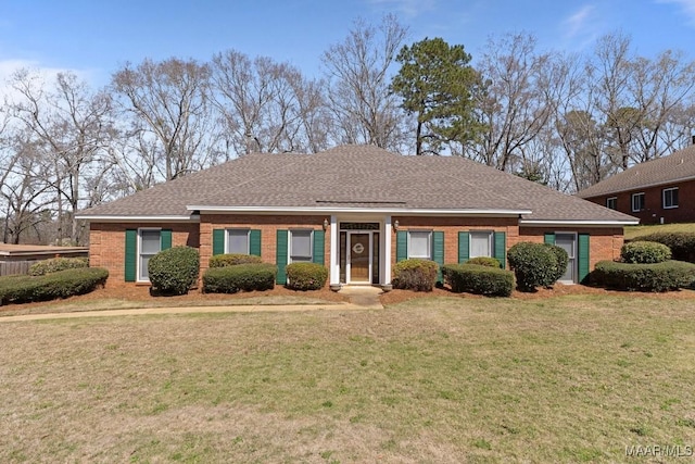 single story home featuring a front lawn, brick siding, and roof with shingles