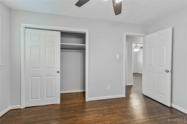 unfurnished bedroom with a ceiling fan, wood finished floors, a closet, and baseboards