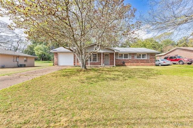 ranch-style house with brick siding, driveway, and a front yard