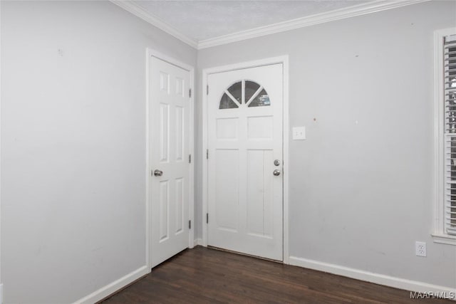 foyer entrance featuring baseboards, dark wood finished floors, and ornamental molding