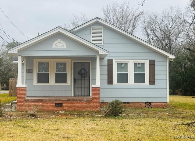 bungalow-style home with a front lawn and crawl space