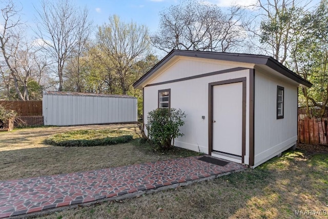 view of shed with fence