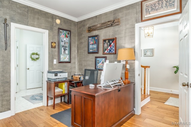 office featuring light wood-type flooring, crown molding, and baseboards