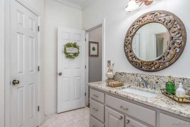 bathroom with tile patterned flooring, vanity, and ornamental molding