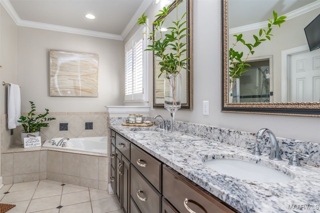 bathroom featuring a sink, a bath, crown molding, and tile patterned flooring