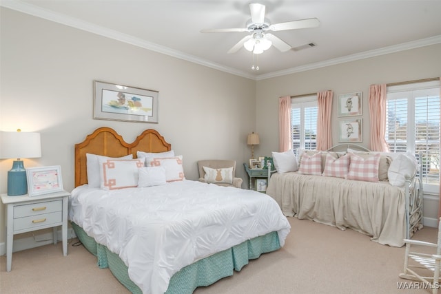 carpeted bedroom with visible vents, a ceiling fan, and ornamental molding