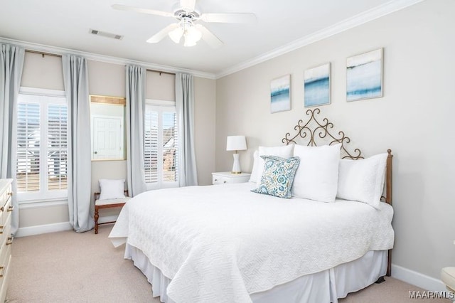 bedroom with visible vents, light carpet, multiple windows, and crown molding