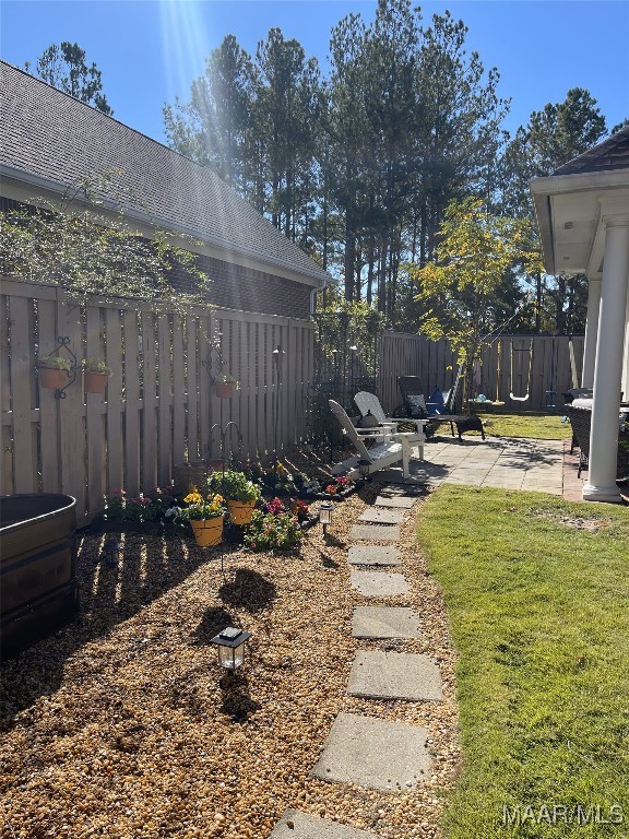 view of yard with a patio area and fence