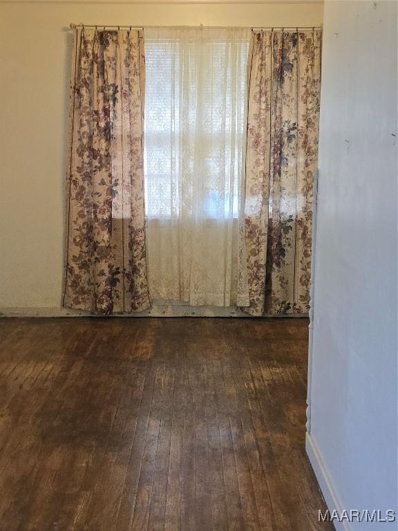 empty room with hardwood / wood-style floors