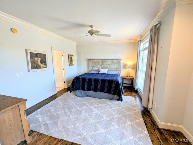 bedroom with ceiling fan, baseboards, wood finished floors, and crown molding