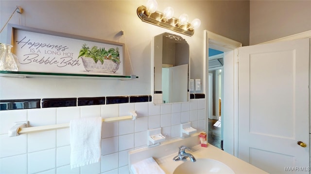 bathroom featuring tasteful backsplash and a sink