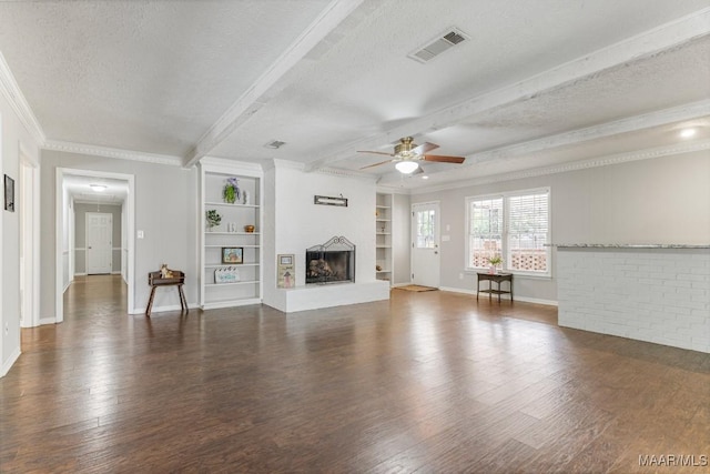 29 Creek Dr, Montgomery, AL 36117 - unfurnished living room with visible vents, ceiling fan, beam ceiling, wood finished floors, and a textured ceiling