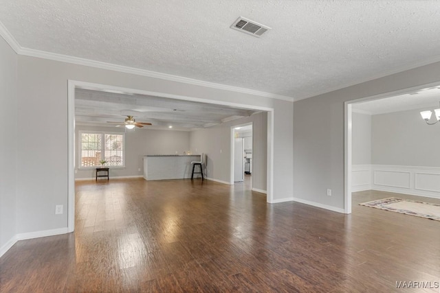 29 Creek Dr, Montgomery, AL 36117 - unfurnished living room with ceiling fan with notable chandelier, wood finished floors, visible vents, and a textured ceiling