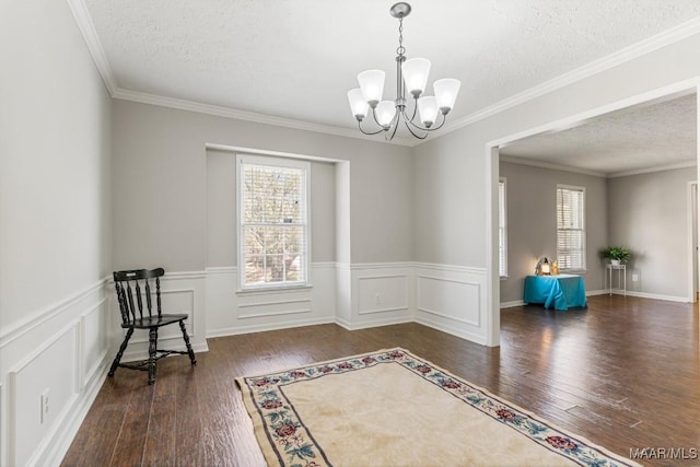 29 Creek Dr, Montgomery, AL 36117 - unfurnished room with wood-type flooring, a textured ceiling, and an inviting chandelier