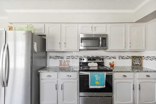 29 Creek Dr, Montgomery, AL 36117 - kitchen featuring backsplash, appliances with stainless steel finishes, crown molding, and white cabinetry