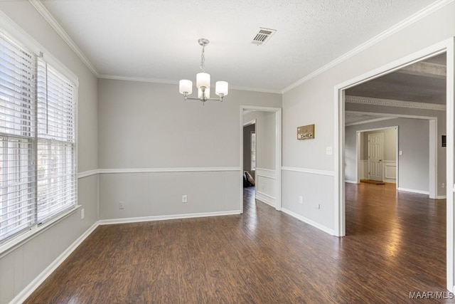 29 Creek Dr, Montgomery, AL 36117 - spare room with visible vents, ornamental molding, wood finished floors, baseboards, and a chandelier