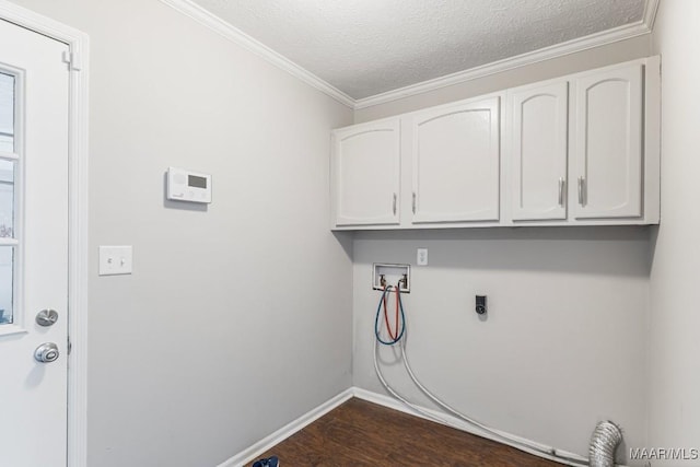 29 Creek Dr, Montgomery, AL 36117 - washroom featuring electric dryer hookup, ornamental molding, dark wood finished floors, cabinet space, and hookup for a washing machine