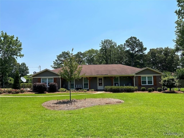 single story home featuring brick siding and a front lawn