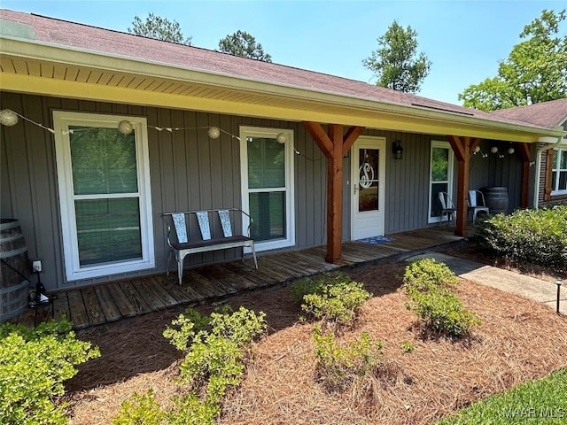 view of front of home featuring a porch, board and batten siding, and a shingled roof