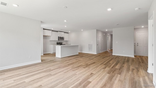3140 Knotts Dr, Montgomery, AL 36116 - unfurnished living room with light wood-style flooring and recessed lighting