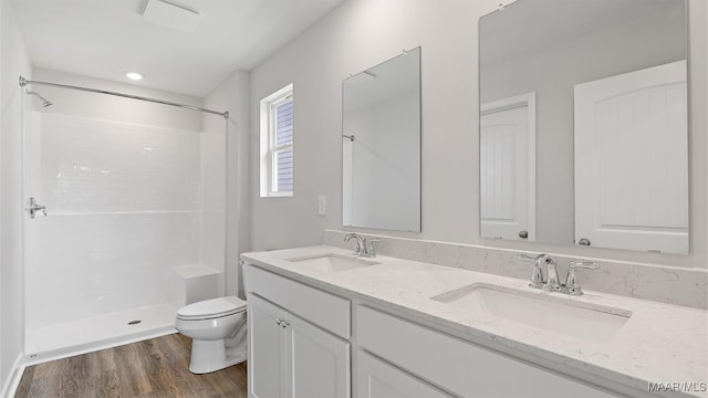 3140 Knotts Dr, Montgomery, AL 36116 - full bathroom with double vanity, wood finished floors, and a shower