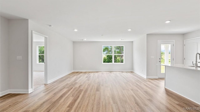 3140 Knotts Dr, Montgomery, AL 36116 - unfurnished living room featuring light wood-style flooring and recessed lighting