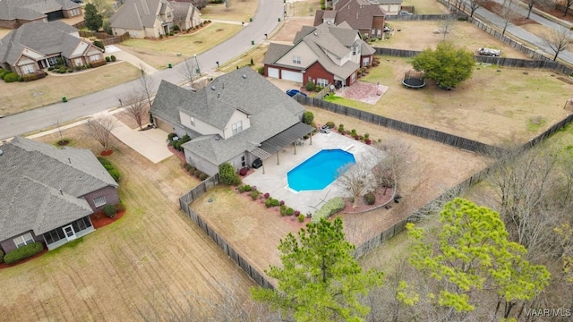 birds eye view of property with a residential view